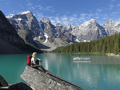 Female Hiker Pauses Above Shore Of Moraine Lake High Res Stock Photo