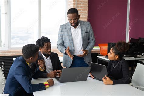 Team Of Young African People In The Office At Work Stock Photo Adobe