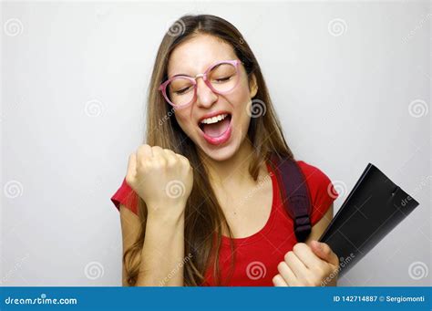 Portrait Of Excited Smiling Female Student Celebrating Success Isolated