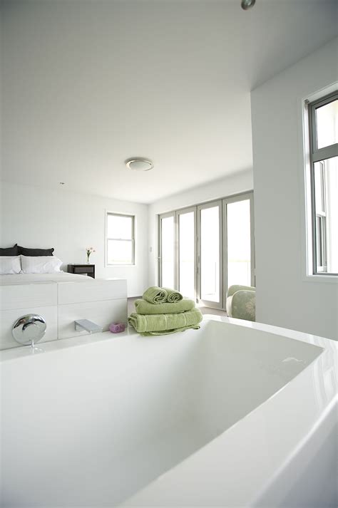Open plan bedroom and bathroom designs. Looking back to the bed and the view in this open plan ...