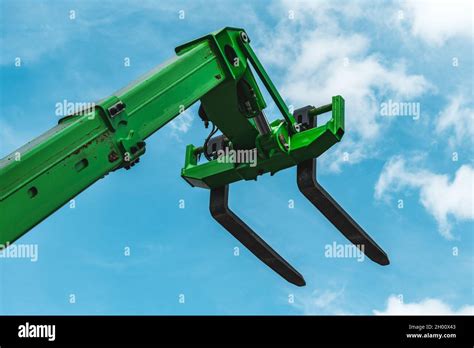 Forklift Forks Industrial Machinery And Equipment Against Blue Sky