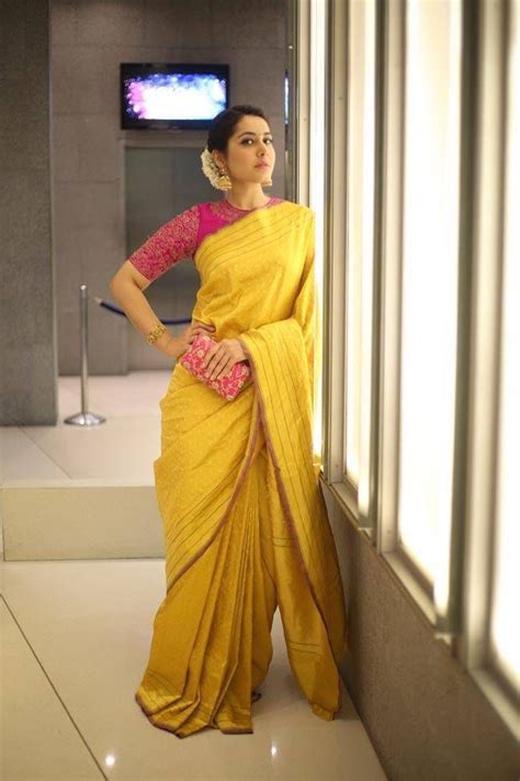 Rashi Khanna Smiling Stills In Yellow Saree At Director Krish