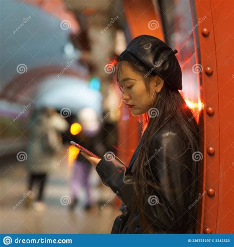 trendy japanese girl suffer from smartphone and social media addiction miss train at subway