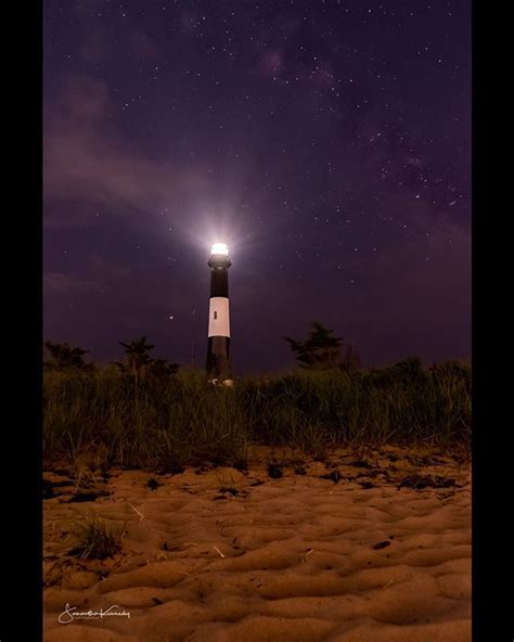 Stars Over The Fire Island Lighthouse With Its Beacon Shining Bright
