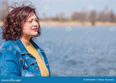 mature plus size woman in nature atmosphere stock image image of beauty denim 209268439