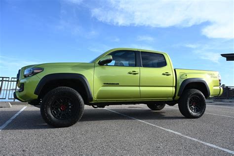Two Trucks Profiled Electric Lime 2022 Toyota Tacoma And Rugged 2022