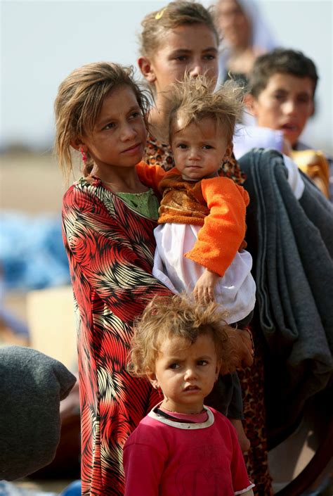 Displaced people from the minority Yazidi sect, who fled the violence ...