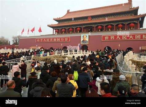 Tourists Crowd The Square In Front Of The Tiananmen Rostrum During The