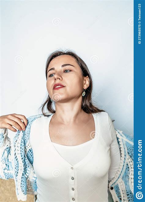 Photo Of A Woman Undressing Cute Young Woman Takes Off Blue Sweater Stock Image Image Of