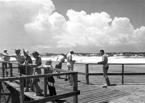 Where are the piers located? Florida Memory • People fishing and watching on the pier ...