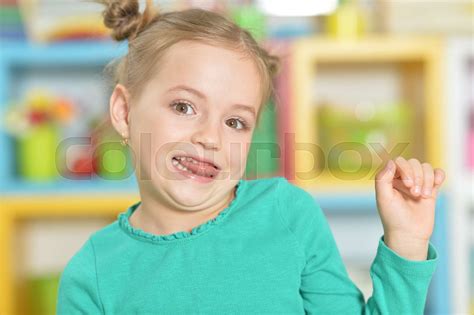 Portrait Of Little Girl Making Funny Faces Stock Image Colourbox