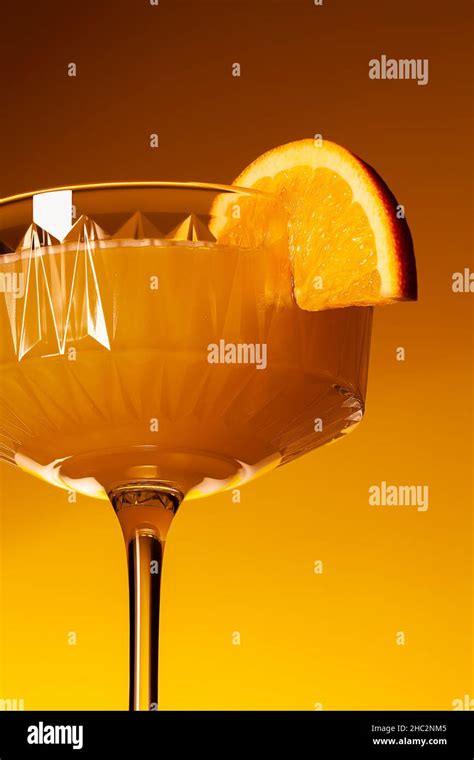 glass of vegan fruit alcohol free mimosa cocktail close up refreshing festive orange mocktail