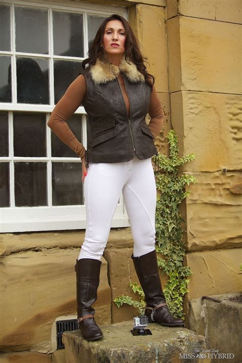 An English Lady In White Jodhpurs And Riding Boots Enjoying Country Pursuits