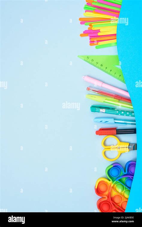 Vertical Composition With School Stationery Border Frame On Blue