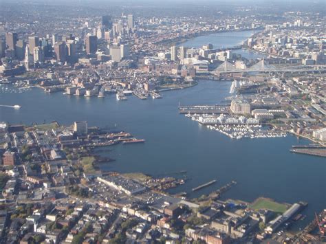 An Aerial View Of A City And Harbor