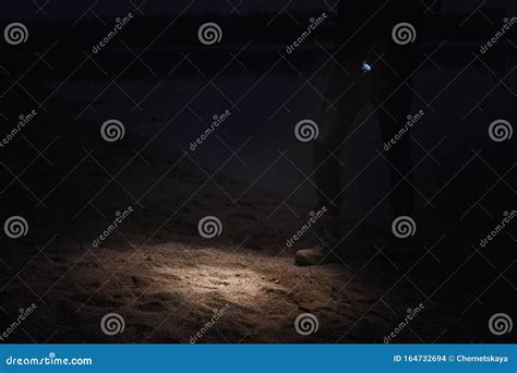 Man With Flashlight Walking Near River At Night Stock Photo Image Of
