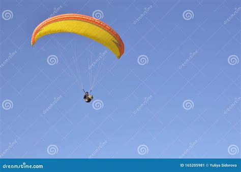 People Engage In Active Sports Paragliding Paraglider Hovering On