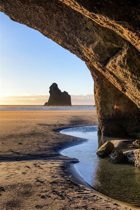 Natural Landscape Of Cave Exit Towards Ocean In Wharariki Beach New