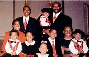 Cruiserweight champion Evander Holyfield and his large family: wife, kids