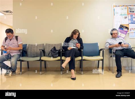 People Sitting And Waiting In A Hospital Waiting Room In Toronto