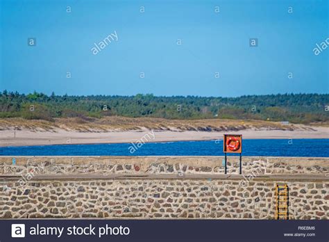 Wave Breaker With Spindrift Stock Photo Alamy