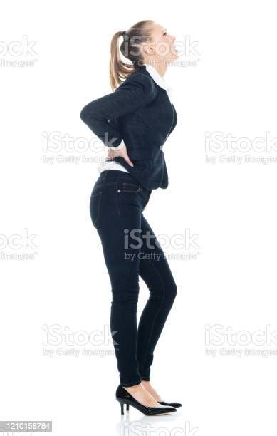 Female Business Person Bending Over In Front Of White Background