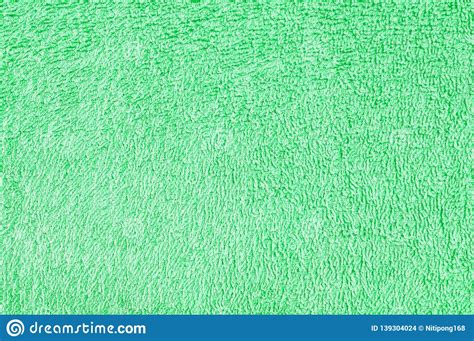 Closeup Surface Fabric Pattern At Old Green Fabric Towel