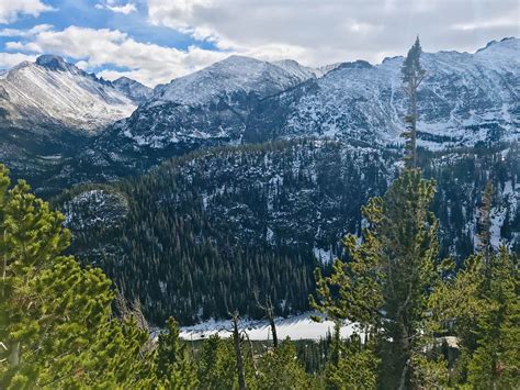 Snow Capped Peaks Of The Rocky Mountains Overlooking Dream Lake Oc