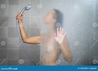 Young woman in shower stock photo. Image of personal - 130625830