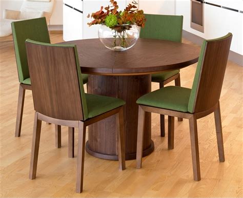 A folding design makes the. Trendy Expandable Round Dining Table by Skovby - DigsDigs