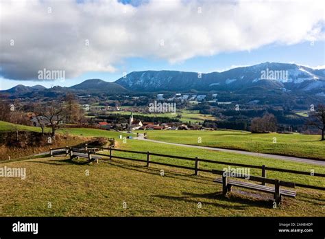 View On Alps Mountains Blue Sky Clouds Green Field Church By