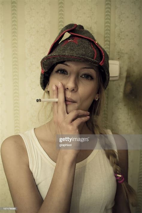 Young Woman Smoking Cigarette High Res Stock Photo Getty Images