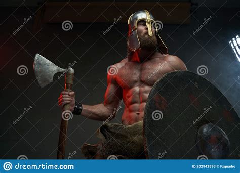Warlike Shirtless Viking With Axe Posing In Dark Background Stock Photo