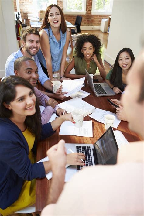 Group Of Office Workers Meeting To Discuss Ideas Stock Image Image Of