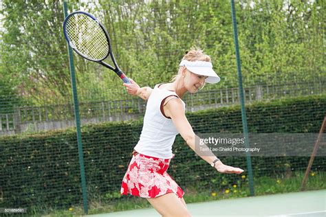 Mature Woman Playing Tennis ストックフォト Getty Images