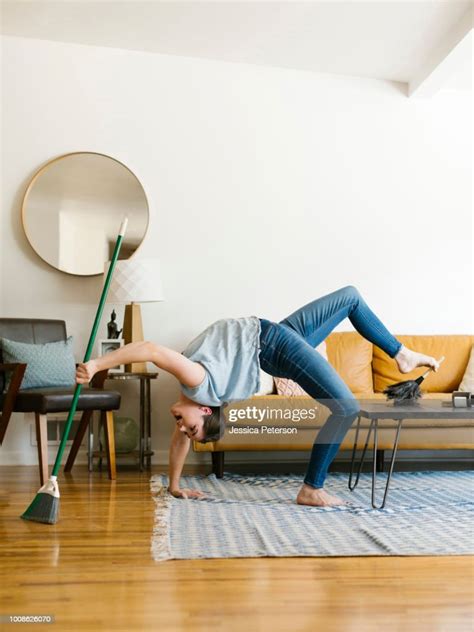 Woman Bending Over Backwards Sweeping And Dusting Photo Getty Images