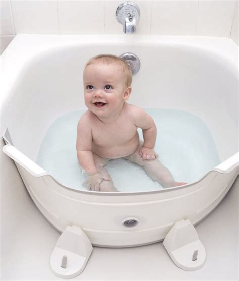 Magnets hold it in place. Bathtub Divider Turns Your Family Tub Into Your Baby's Tub ...