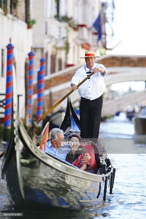 Italy Venice Mature Couple In Gondola On Canal Smiling Photo Getty Images