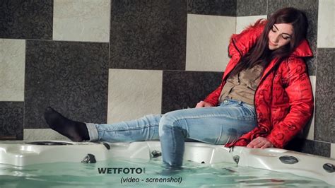 wetlook by beautiful girl in red jacket brown blouse tight jeans in jacuzzi wetlook one