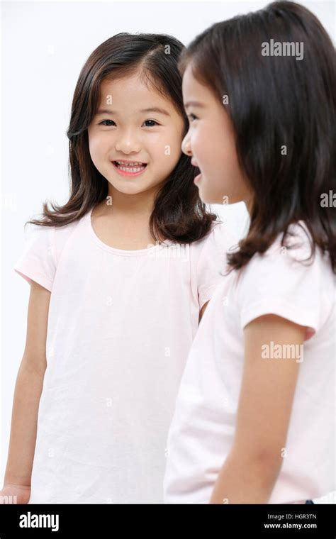 Smiling Twin Girls Stock Photo Alamy