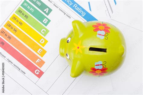 Energy Efficiency Chart And Piggybank Close Up Studio Shot From Top