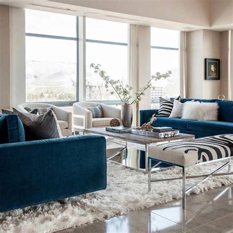 Most of the rooms pair the sofas with a white or grey wall, although some of the more bold designers are choosing to match the sofa with a blue painted wall! Get the look: Modern blue sofa living room # ...