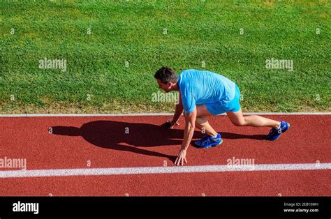 Running Tips For Beginners Man Athlete Stand Low Start Position Stadium Path Runner Ready To