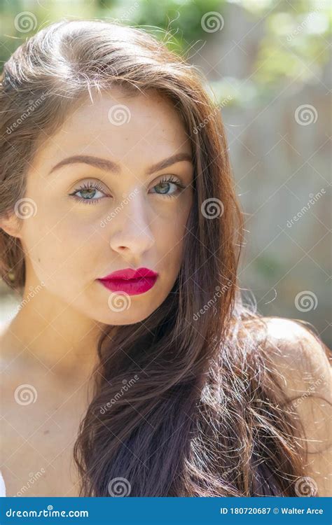 A Lovely Brunette Model Enjoys An Spring Day Outdoors Stock Image