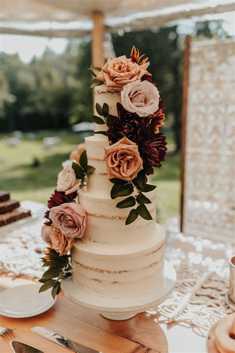 Naked Cake With Rustic And Boho Chic Florals On Cake Bar And Dessert Buffet Atop A Macrame