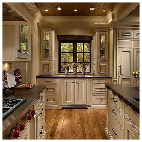 Cream kitchen cabinets with wood brown countertops. Cream Color Kitchen Cabinets With Dark Floors | Light kitchen cabinets, Cherry cabinets kitchen ...