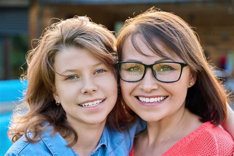 Portrait Of Happy Mom And Teenage Daughter Looking At Camera Stock Image Image Of Woman