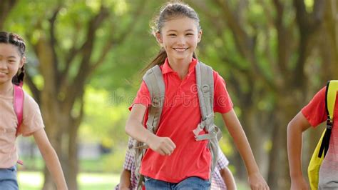 Happy Elementary School Kids Running At School Back To School Stock