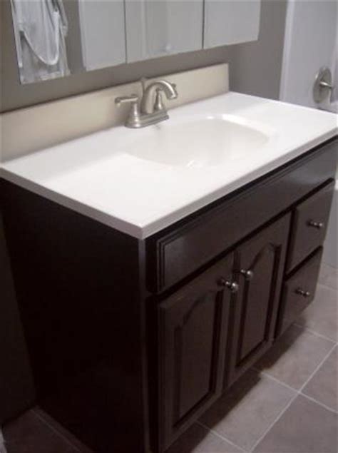 In an effort to save money during the remodel of my bathroom, and being somewhat green at the same time, i decided that instead of buying a new bathroom sink and vanity, i would clean up the sink and refinish the vanity. Bathroom Vanity Makeover - Crafting a Green World