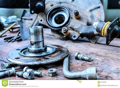 Old Oiled Wheel Hub Lies On A Wooden Table Stock Photo Image Of